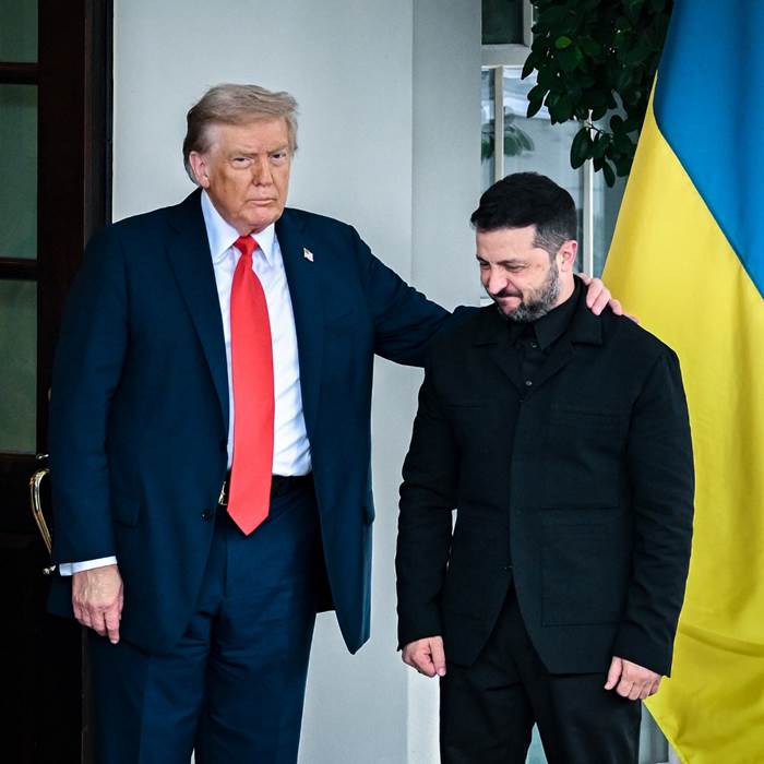 Mr. Trump with arm around Mr. Zelensky.